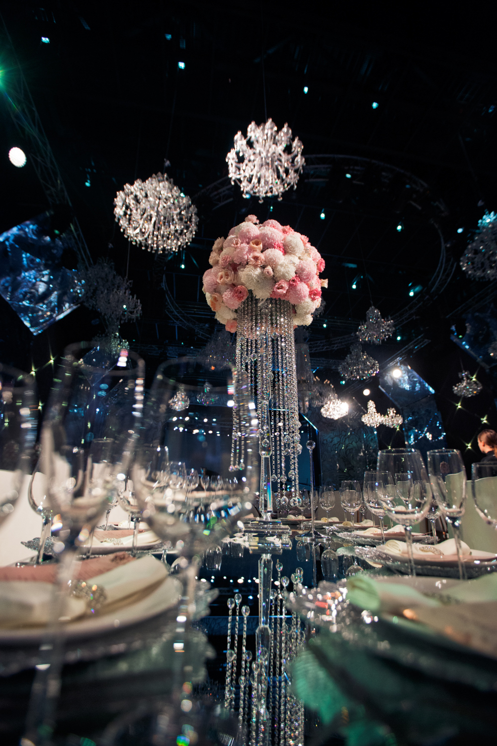 tall-centrepiece-made-pink-flowers-crystal-chains-stands-dinner-table